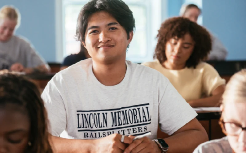 LMU student learning in a small classroom